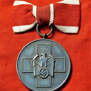 WW2 GERMAN RED CROSS SOCIAL WELFARE MEDAL WITH FEMALE TIED BOW RIBBON