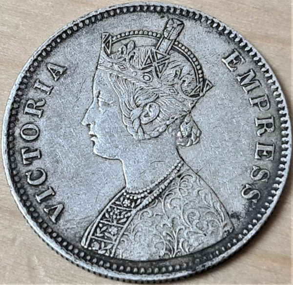 Offered is an original British India 1884 1 Rupee silver coin. We are not coin dealers or experts, so please view photos to determine grade etc. We combine postage on orders.