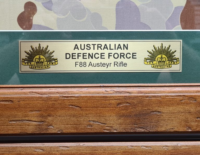 Framed 2000’s Australian Army ADF framed F88 Steyr rifle & medals Desert