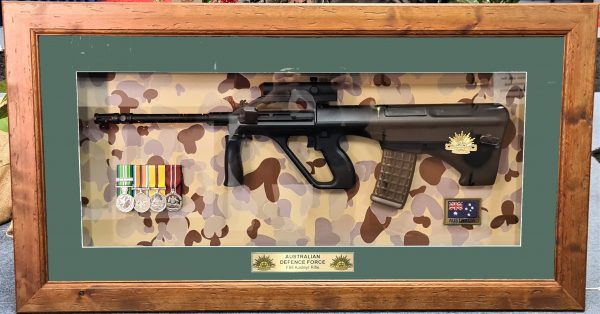 Framed 2000’s Australian Army ADF framed F88 Steyr rifle & medals Desert