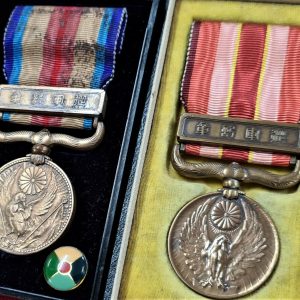 VINTAGE WW2 ERA JAPANESE MEDALS IN AWARD CASES FOR CHINA SERVICE