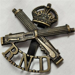 WW1 BRITISH ROYAL NAVAL DIVISION MACHINE GUN UNIFORM CAP BADGE