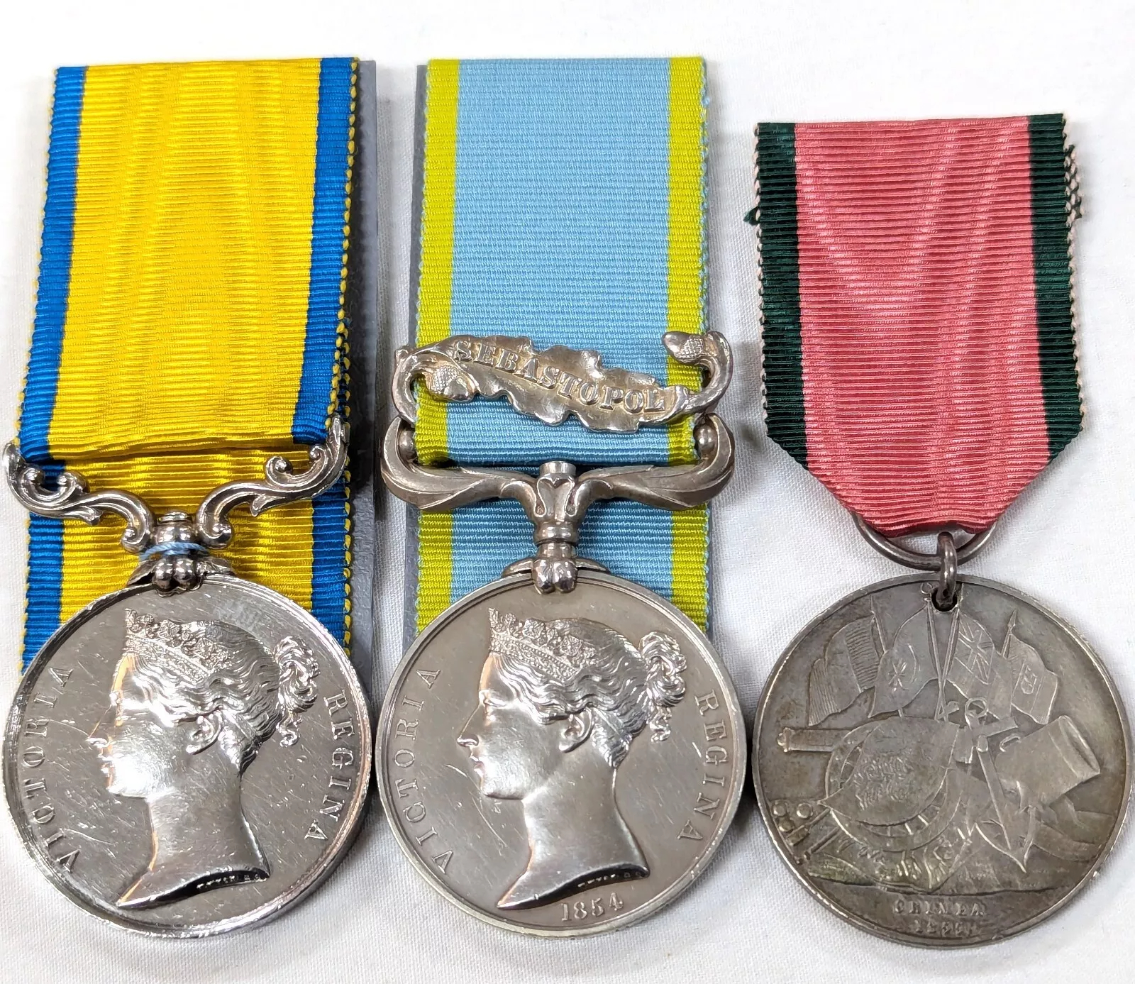 For sale is set of Royal Navy medals attributed to Ordinary Seaman Joshua Brunsden, who served in the Crimean War aboard H.M.S. Hannibal. Baltic Medal 1854-55, unnamed as issued; Crimea War Medal 1854-56, with clasp Sebastopol, impressed named JOSH BRUNSDEN, ORD. H.M.S. HANNIBAL,; Turkish Crimea Medal 1855-56 (British issue), unnamed as issued. HMS Hannibal served in the Baltic in 1854 and the Crimea in 1855.