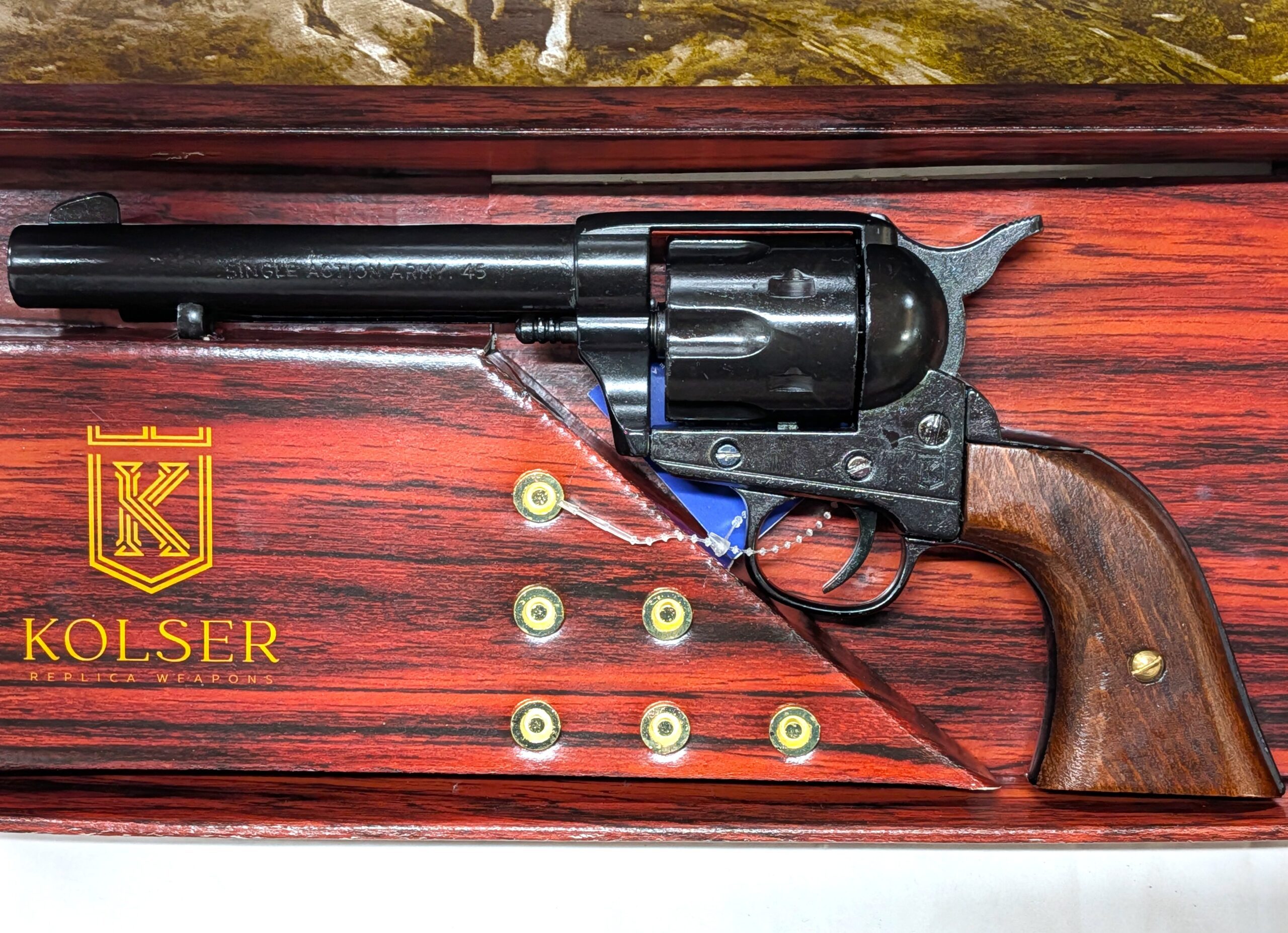 Replica Peacemaker Single Action Army 45cal Revolver. Very realistic appearance with black "blued" tone finish and faux bone ivory grips with raised snake design, 26cm in length, cap firing capability and comes in presentation box with 6 replica brass tone rounds with lead look bullet heads. Great addition to your collection of Replica Firearms. It is an offence to sell replica firearms and knives to anyone under the age of 18. We will not sell these items or post them to anyone under the age of 18. WE POST WITHIN AUSTRALIA ONLY FOR THESE REPLICA FIREARMS – SO NO OVERSEAS SALES ALLOWED. Posting out within 24 hours of being ordered. The item is a replica weapon. It is designed to resemble in shape, size, weight and basic functionality the firearm it represents. It has basic working parts and or removable parts (check description) and is a genuine Kolser or Denix/Spanish made item. The replica comes in its factory card box. Whilst this replica can be cocked and ‘dry fired’, it cannot fire, nor can it be altered to fire live rounds. These are not intended to be used outside of your private residence and frequent use and or rough play may result in damage to the item which will not be covered by return warranty under Australian Consumer law. No license is required or permit needed to purchase from us if you live in WA, SA and QLD. JB Military Antiques is not responsible for any paperwork you may need to own this product in your locality. We cannot give legal advice to anyone in regards to these replica firearms and suggest that if you have any questions, you contact your local Police Firearms branch for further details.